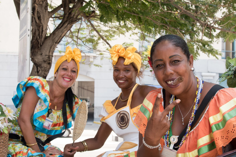 Three backup dancers pose for a photo pose for a shot on their break in Havana, Cuba.