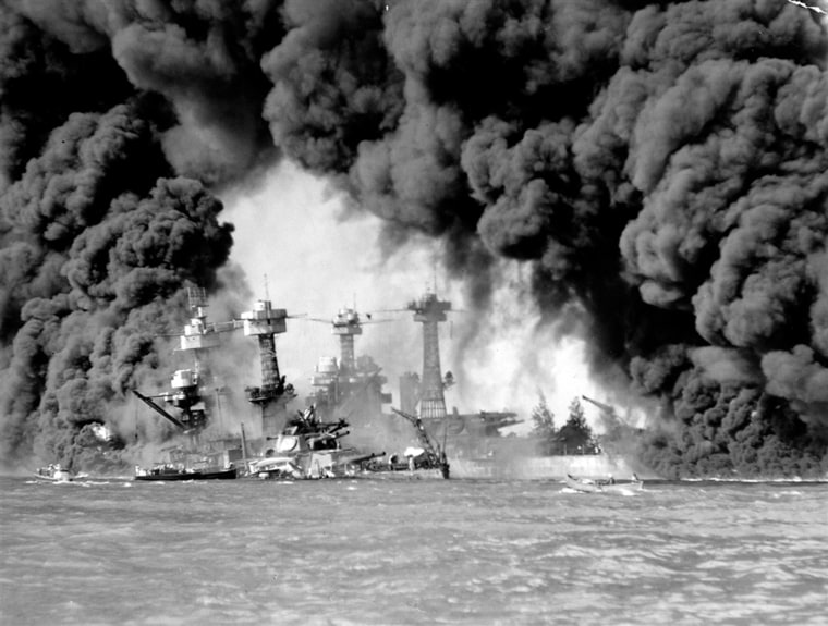 Image: Smoke pours from wrecked American warships.