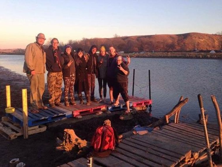 Alicia Smith with other water protectors on a pier she helped build at Standing Rock.