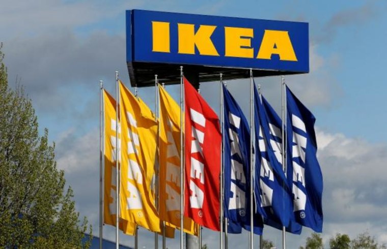 Flags and the company's logo are seen outside of an IKEA Group store in Spreitenbach