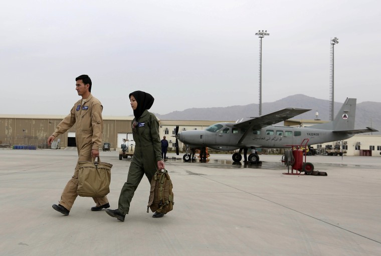 Image: Capt. Safia Ferozi, right, and her husband Capt. Mohammad Jawad Najafi, left