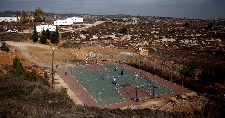 Image: A basketball court is seen in this general view of the Jewish settler outpost of Amona, in the West Bank