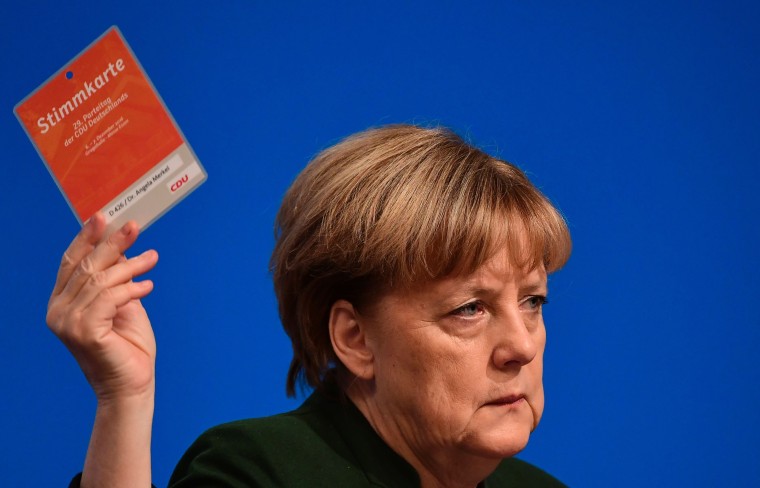 Image: Angela Merkel votes during a the CDU party congress in Essen, Germany.