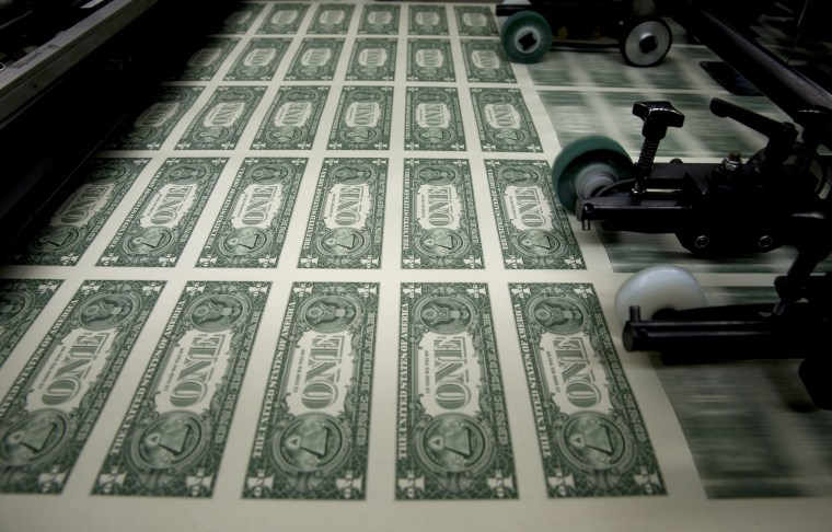 Image: One dollar note sheets are run through an intaglio printing press