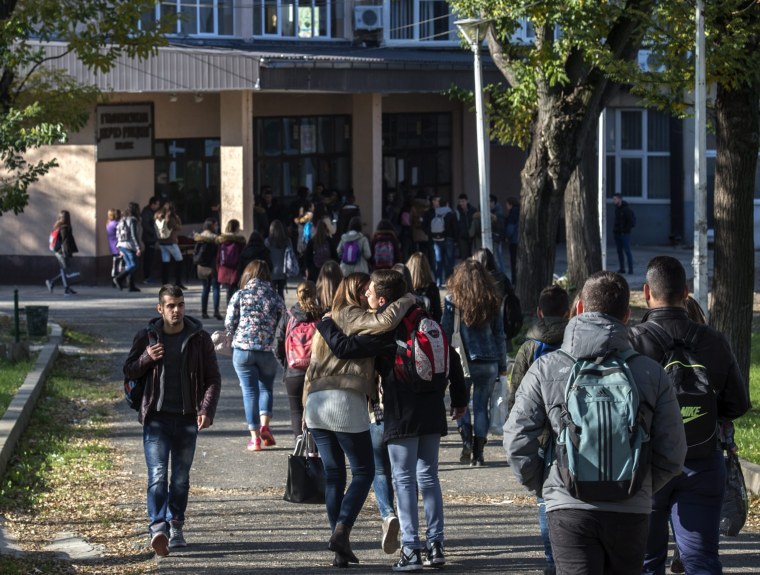 Image: Students arrive in their High school 'Kosta Racin' in the town of Veles