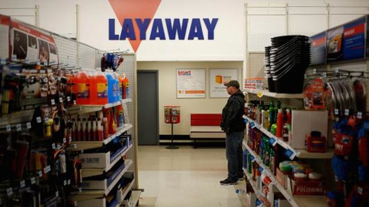A shopper stands near the layaway counter. Luke Sharrett | Bloomberg | Getty Images