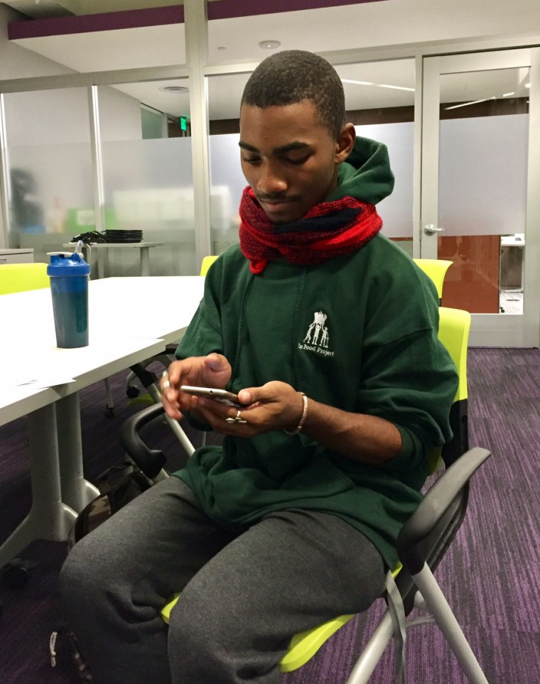 Elijah Corbin Irving, a senior at Snowden International School in Boston, uses the American Student Assistance's Boston Public Library College Planning Center as a resource. He also gets help with his Common Application from Bernardo Barbosa, a member of Boston University's College Advising Corps, a nonprofit that works with Boston high school students.