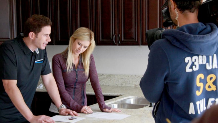 Husband and wife team, Tarek and Christina El Moussa, discuss renovation plans on the set of HGTV's Flip or Flop.