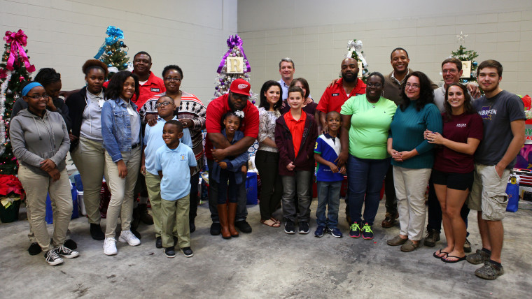 The five families from the Greater Baton Rouge Food Bank with NBC's Craig Melvin