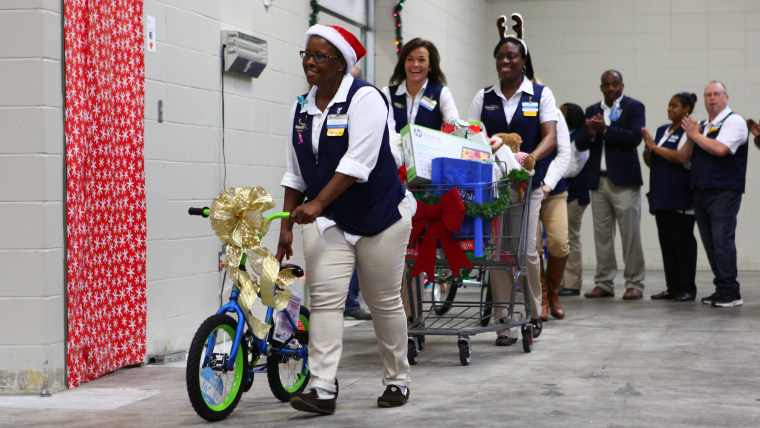 Walmart workers surprise families with gifts