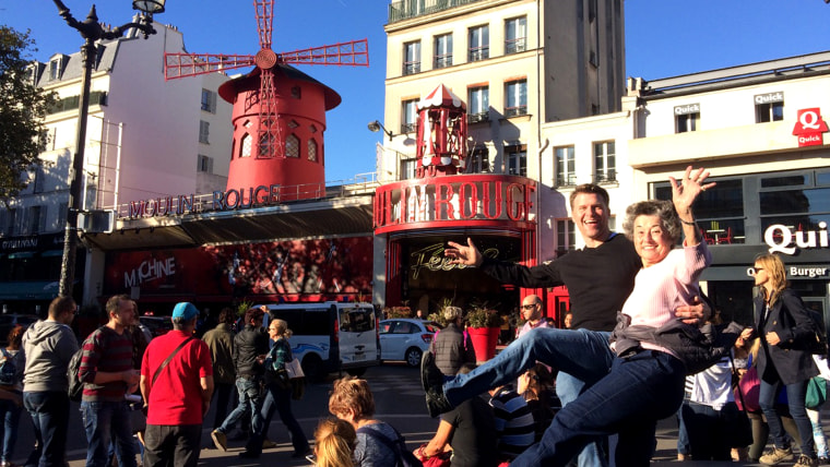 Gregg Goodbrod and his soon-to-be mother-in-law, Carla Brooks practice their can can outside the Moulin Rogue. Goodbrod enjoys having an adventure with his fiance and mother-in-law.