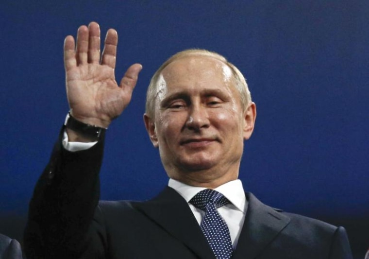Russia's President Putin waves during the closing ceremony for the 2014 Sochi Winter Olympics