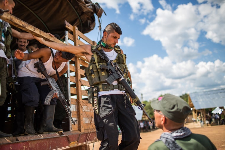 Image: FARC rebels from nearby camps arrive for the meeting