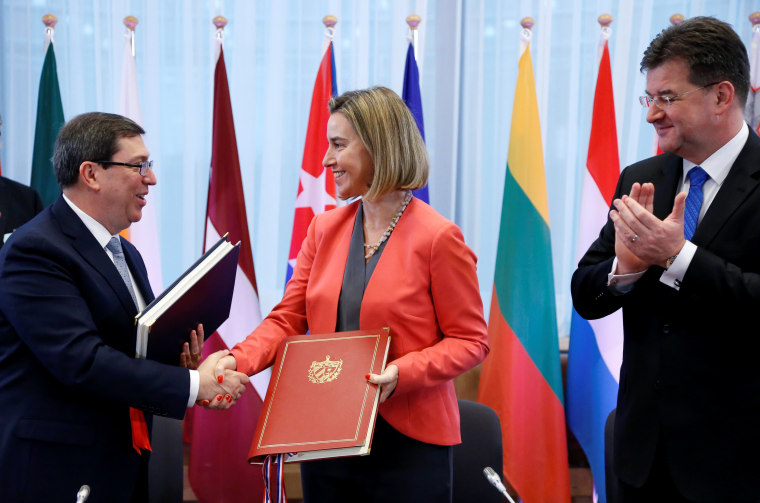 Cuba's Foreign Minister Rodriguez shakes hands with EU foreign policy chief Mogherini
