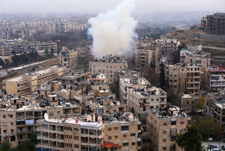 Image: Smoke rises from the al-Ethaa government-held neighborhood in eastern Aleppo during clashes on Dec. 5.