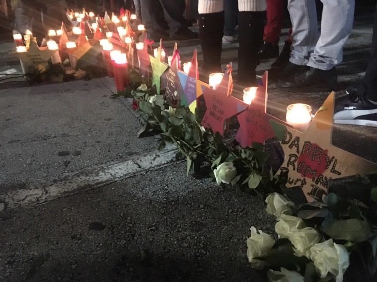 Family and friends of victims, and survivors of the Pulse nightclub attack gather at the club at 2:02 a.m., the time when the shooting started, on Monday, Dec. 12, 2016, the six-month anniversary of the tragedy.