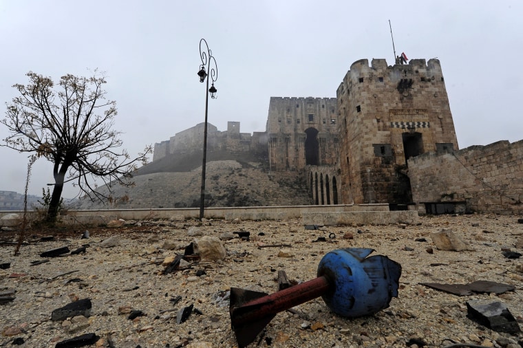 Image: The remains of a shell are pictured outside Aleppo's historic citadel in 2016