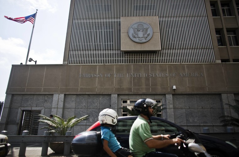 Image: Motorists drive past the U.S. Embassy in Tel Aviv in August 2013