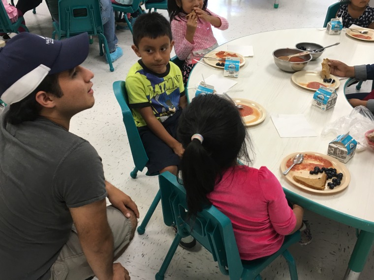 Misael Rangel with toddler at the Parksley Center on the Virginia Eastern Shore , part of the East Coast Migrant Head Start Project.