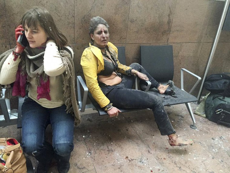 Image: Injured people are seen at the scene of explosions at Zaventem airport near Brussels