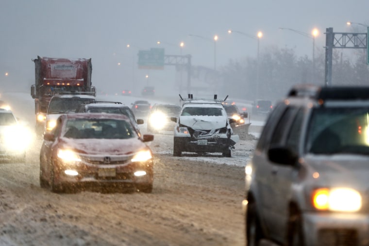 A vehicle involved in a crash sits on the fast lane of Highway Interstate 80 after an accident during a snowfall, Saturday, Dec. 17, 2016, in Lodi, N.J.