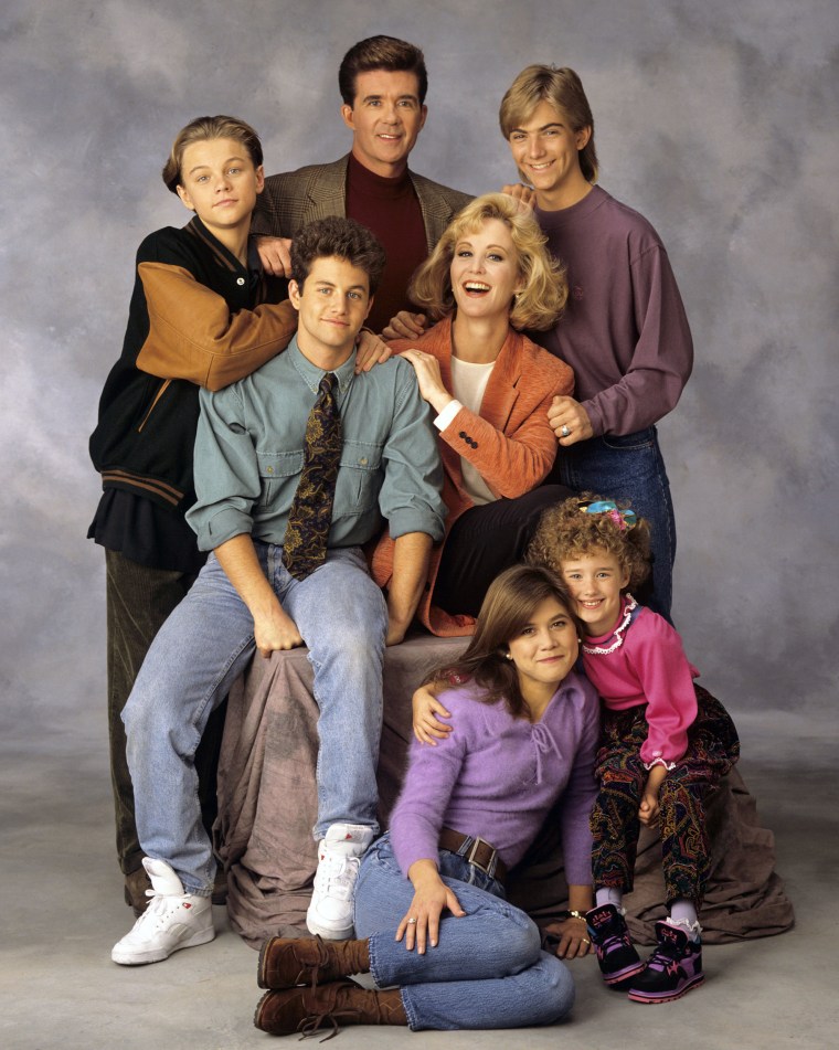 The cast of "Growing Pains," in 1991 standing from left, Leonardo DiCaprio, Alan Thicke and Jeremy Miller, with Kirk Cameron, seated center left, and Joanna Kerns, seated center right, and Tracey Gold, seated left on floor and Ashley Johnson.