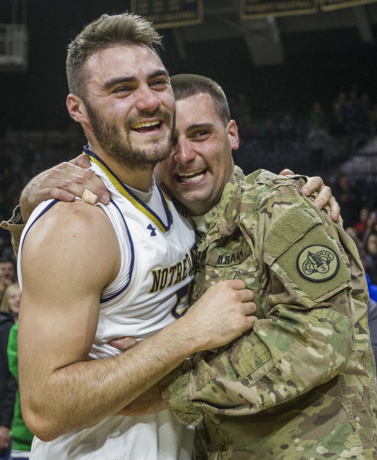 Matt Farrell, left, is surprised by his brother Bo Farrell