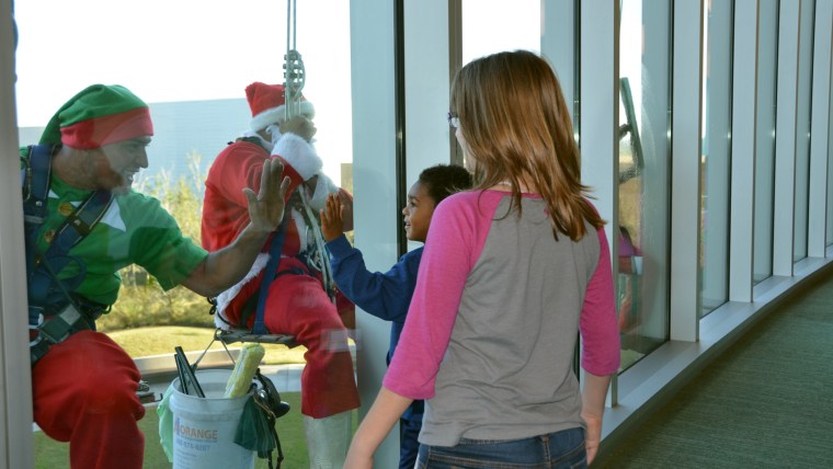 Window-washing Santa, elves surprise patients at Nemours Children's Hospital