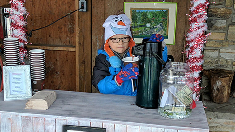 Matthew McDonald raises $6,500 from a hot cocoa stand for other kids with cancer.