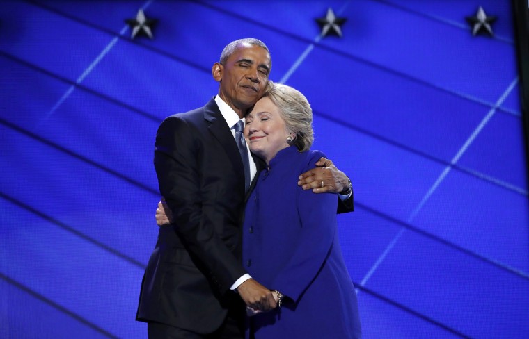 Image: Democratic presidential nominee Clinton hugs U.S. President Obama as she arrives onstage at the end of his speech on the third night of the 2016 Democratic National Convention in Philadelphia