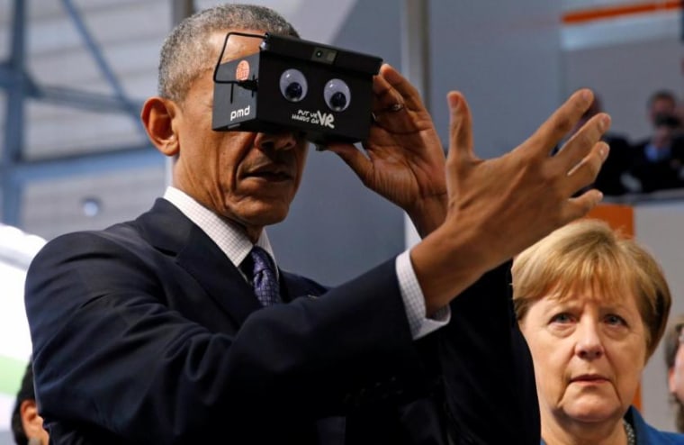 U.S. President Obama tries virtual reality glasses as he and German Chancellor Merkel tour Hanover Messe Trade Fair in Hanover