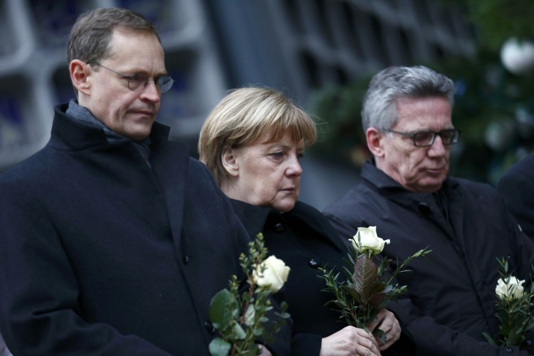 Image: Berlin Mayor Michael Mueller, German Chancellor Angela Merkel and German Interior Minister Thomas de Maiziere 