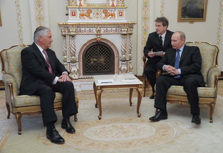 Image: Russian Prime Minister Vladimir Putin, right, listens to Rex W. Tillerson, chairman and chief executive officer of Exxon Mobil Corporation at their meeting outside Moscow, April 16, 2012.