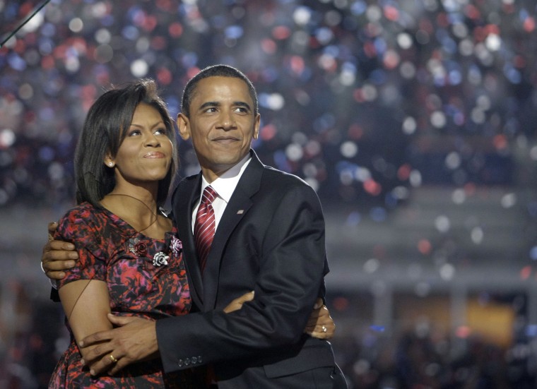 Image: Democratic presidential candidate, Sen. Barack Obama, D-Ill., hugs his wife, Michelle Obama, after giving his acceptance speech at the Democratic National Convention at Invesco Field at Mile High in Denver, Aug. 28, 2008.