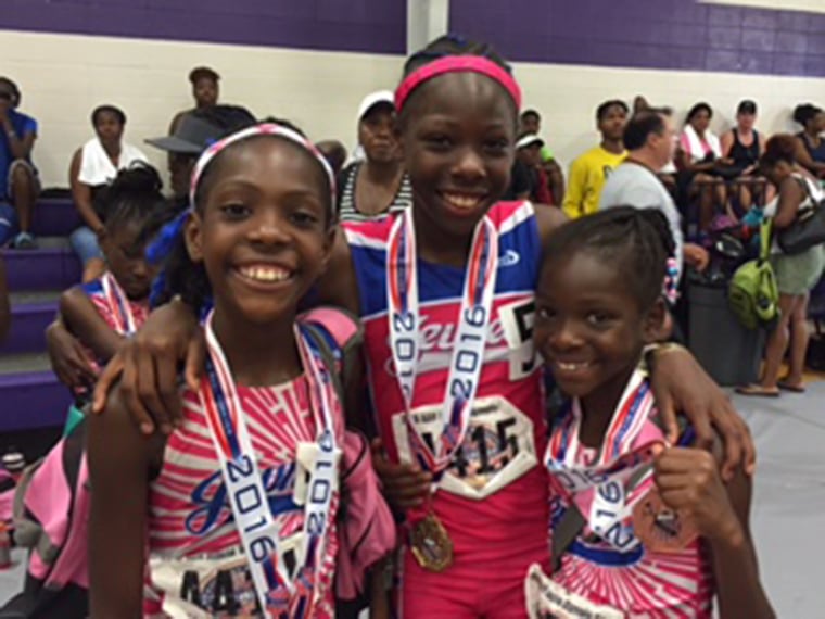 Sheppard Sisters, Rainn, Tai, and Brooke, celebrate their accomplishments after 2016 AAU Junior Olympics in Houston, Texas.