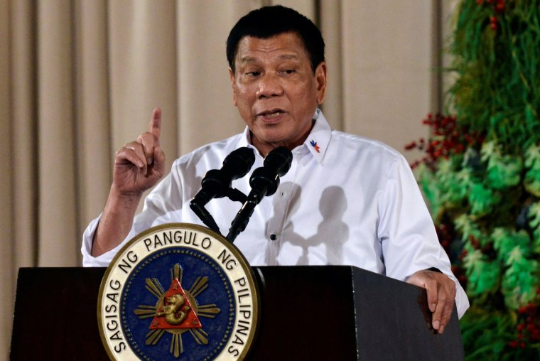 Image: Philippine President Rodrigo Duterte looks on during an awarding ceremony for outstanding Filipinos and organizations overseas, at the Malacanang Palace in Manila