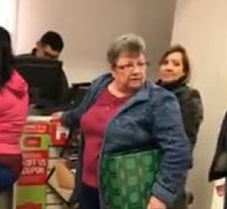 Latin American Sales Woman Working At A Clothing Store Checking