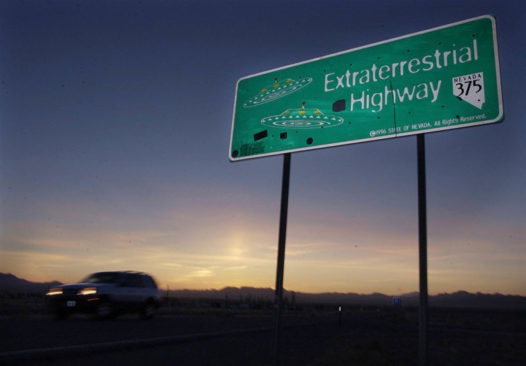 A car moves along the Extraterrestrial Highway near Rachel, Nevada, in this Wednesday, April 10, 2002 file photo.