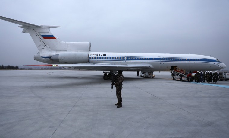 Image: The flag-wrapped coffin of late Russian Ambassador to Turkey Andrei Karlov is carried to a plane during a ceremony at Esenboga airport in Ankara, Turfey, Dec. 20.