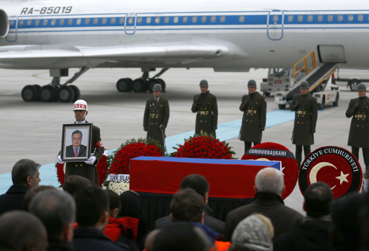 Image: The flag-wrapped coffin of late Russian Ambassador to Turkey Andrei Karlov is carried to a plane during a ceremony at Esenboga airport in Ankara, Turkey, Dec. 20, 2016.