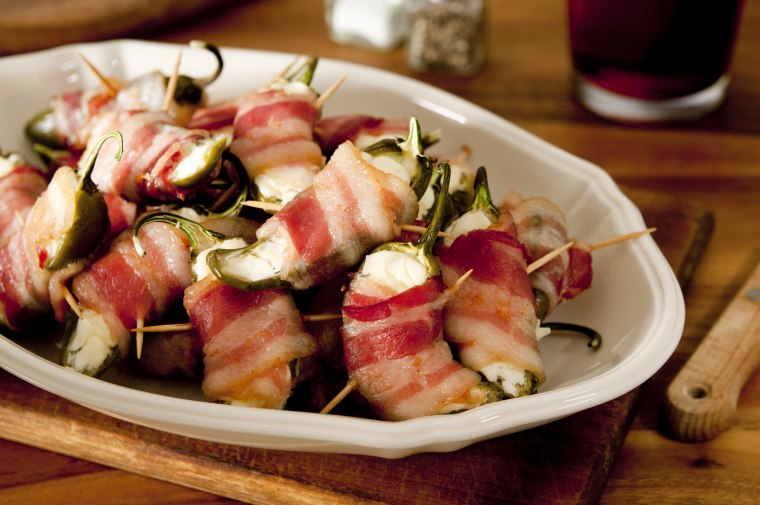 Jalapeno poppers filled with cream cheese and wrapped in bacon.