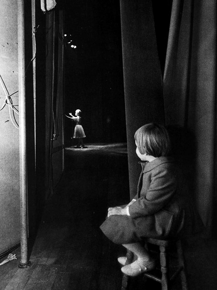 6-year-old Fisher sitting on a stool and watching Debbie Reynolds