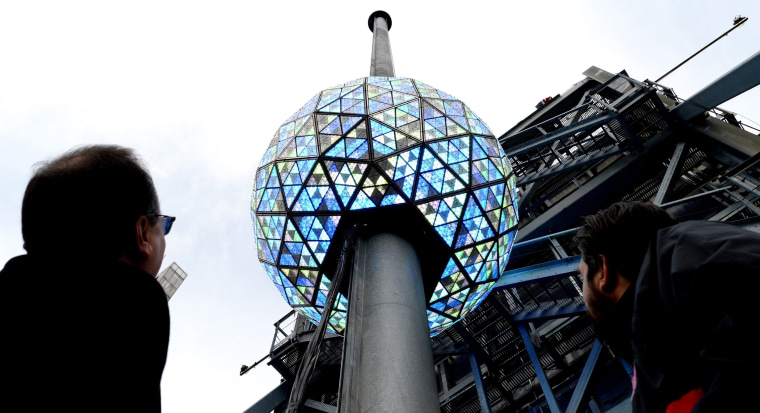 Image: Workers test out the lighting on the New Year's Eve ball
