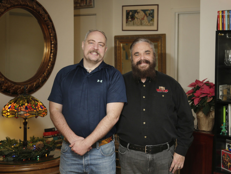 Image: Thor Stockman and Patrick Kellogg pose for a picture in their apartment in New York