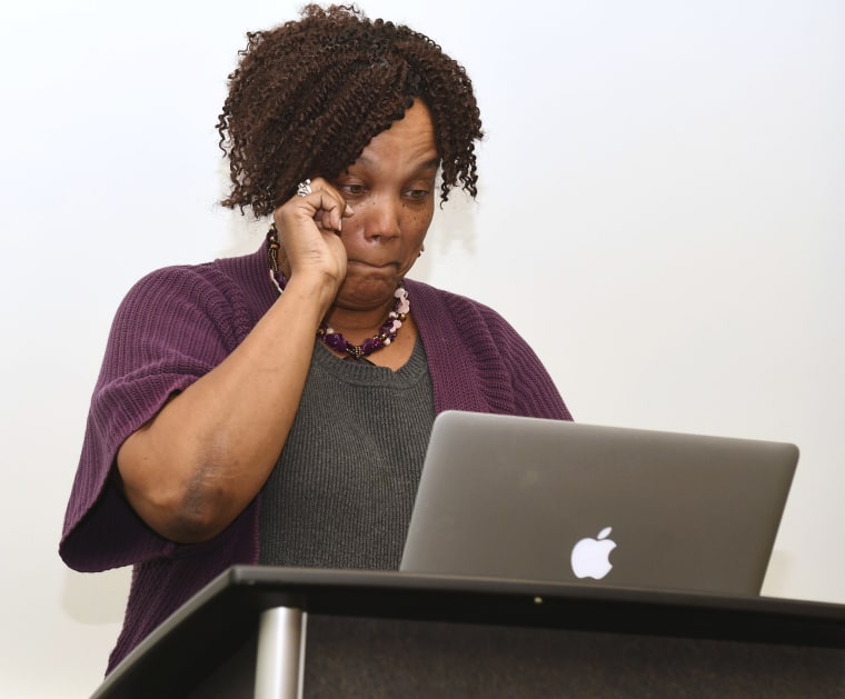 Image: Kathryn Stanley tears up while speaking at Robert Franklin's class on faith and politics at Emory University