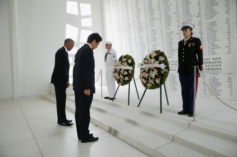 Image: Japanese Prime Minister Abe and U.S. President Obama participate in a wreath-laying ceremony aboard USS Arizona Memorial at Pearl Harbor