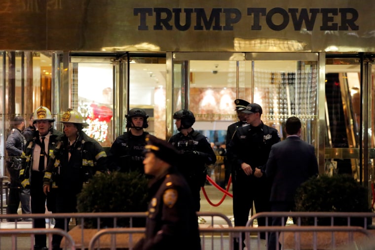 Image: Police and fire crew stand outside Trump Tower following a report of a suspicious package in Manhattan, New York City