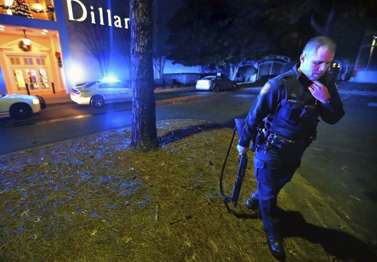 Memphis police officers block off the entrances to the Oak Court Mall on Dec. 26, after a disturbance at the mall in Memphis, Tenn.  Authorities and witnesses say there have been disturbances at two malls in Memphis and one of them had to be shut down.
