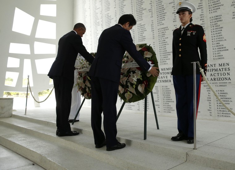 Image: Japanese Prime Minister Abe and U.S. President Obama participate in a wreath-laying ceremony aboard USS Arizona Memorial at Pearl Harbor