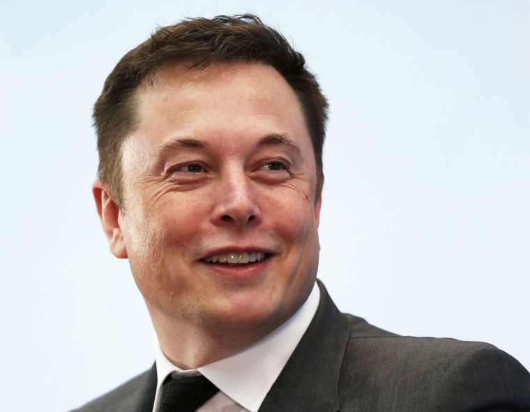 Image: Tesla Chief Executive Elon Musk smiles as he attends a forum on startups in Hong Kong